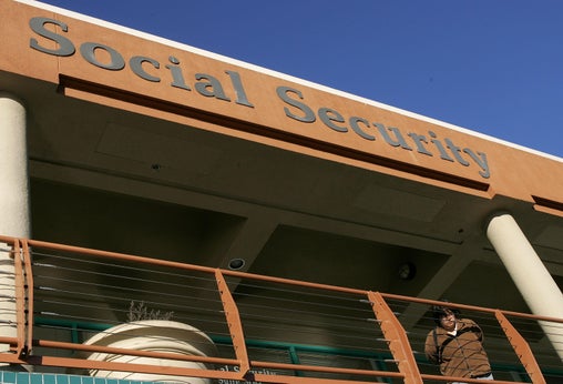A woman stands outside the Social Security Administration office in San Francisco.